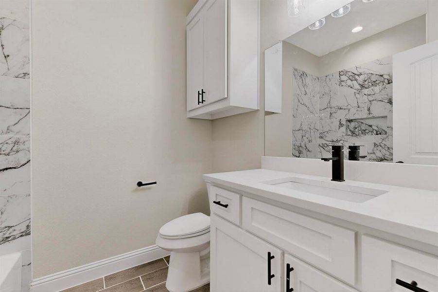 Full bathroom with vanity and recessed lighting Full bathroom with vanity and recessed lighting