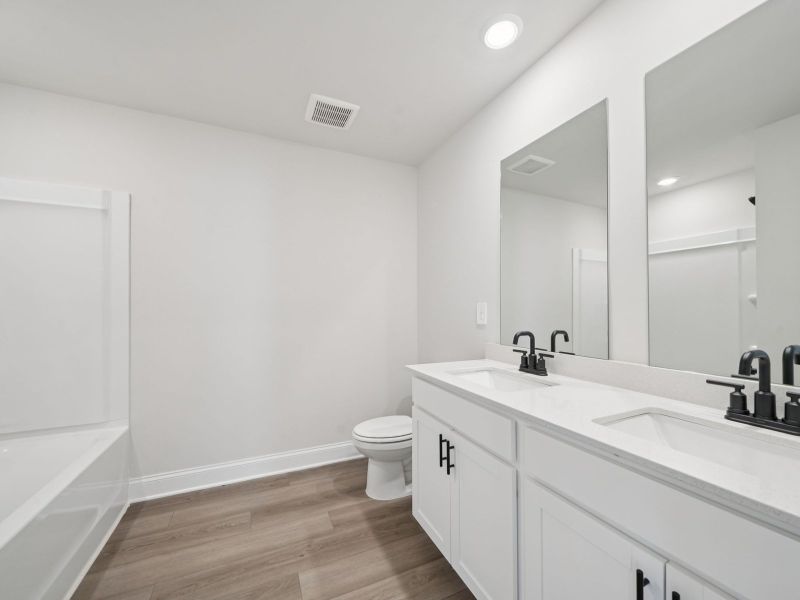Furnished interior view inside a new home in Martin Springs - Estate Series, Lawrenceville (Image 10).