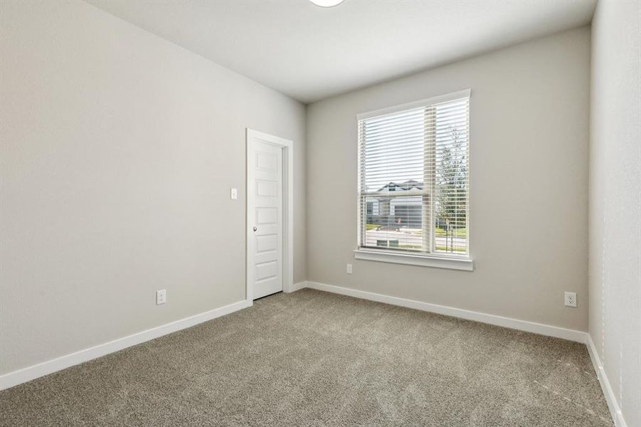 Bedroom in the Emmy II home plan by Trophy Signature Homes - REPRESENTATIVE PHOTO Bedroom in the Emmy II home plan by Trophy Signature Homes - REPRESENTATIVE PHOTO