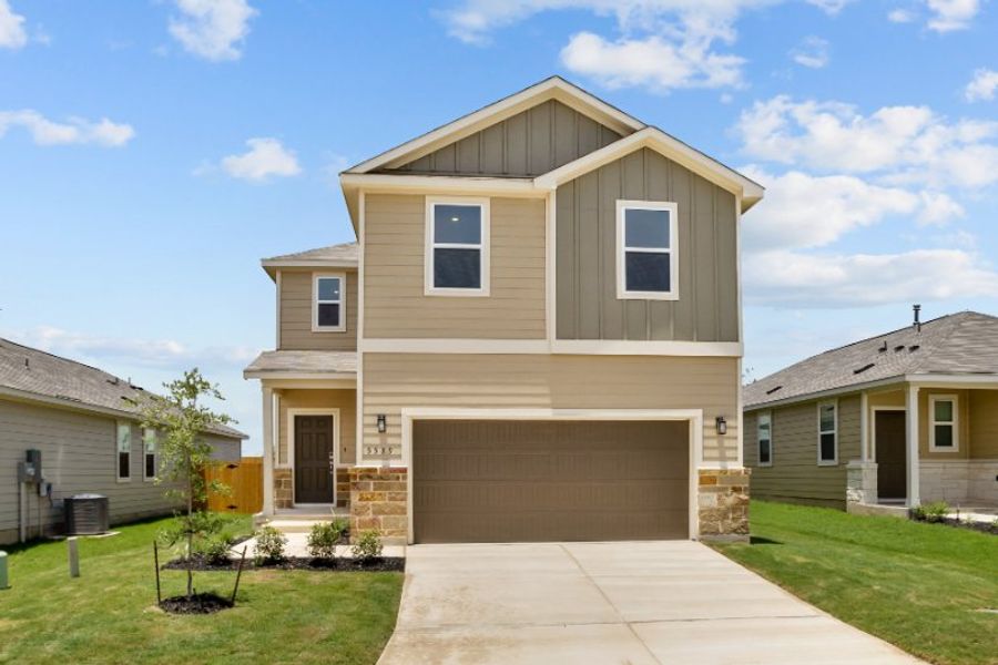Front exterior of a new home in Park Place, New Braunfels, TX, highlighting curb appeal (Image 1). Front exterior of a new home in Park Place, New Braunfels, TX, highlighting curb appeal (Image 1).