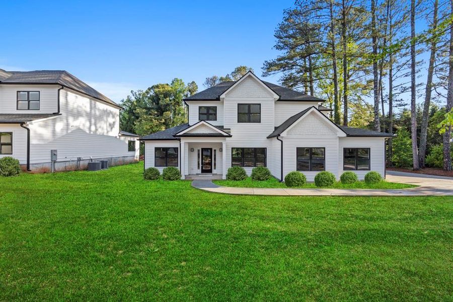 Front exterior of a new home in , Marietta, GA, highlighting curb appeal (Image 1). Front exterior of a new home in , Marietta, GA, highlighting curb appeal (Image 1).