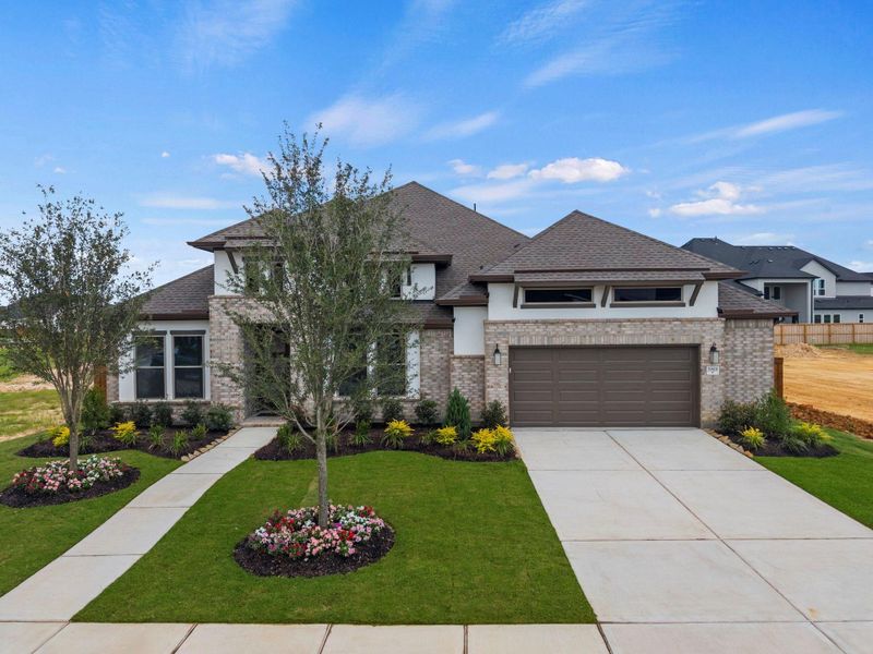 Front exterior of a new home in Dunham Pointe, Cypress, TX, highlighting curb appeal (Image 2). Front exterior of a new home in Dunham Pointe, Cypress, TX, highlighting curb appeal (Image 2).