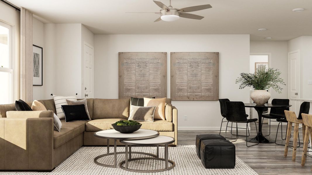 A living room with a couch and chairs.
