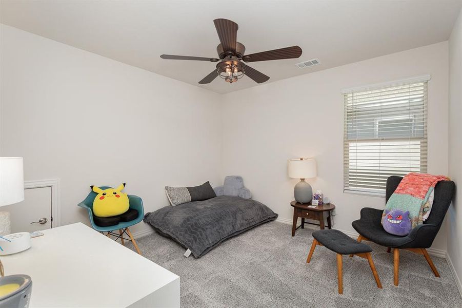 Bedroom featuring carpet and ceiling fan