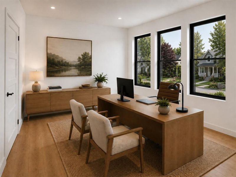 Bright interior space featuring a light wood-finish floor, white walls, and three large windows with black frames