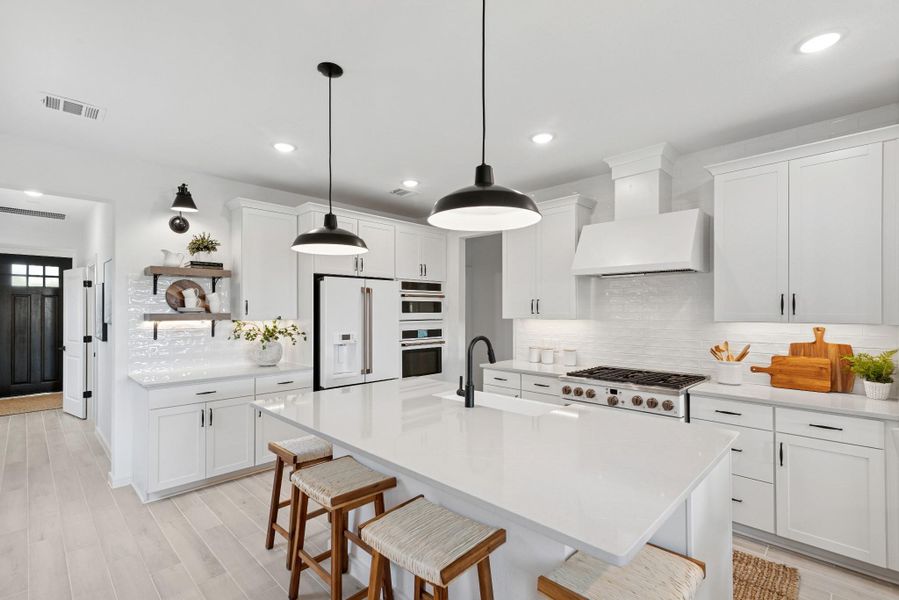 Lovely kitchen with white cabinets and quartz countertops (*Photo not of actual home and used for illustration purposes only.) Lovely kitchen with white cabinets and quartz countertops (*Photo not of actual home and used for illustration purposes only.)