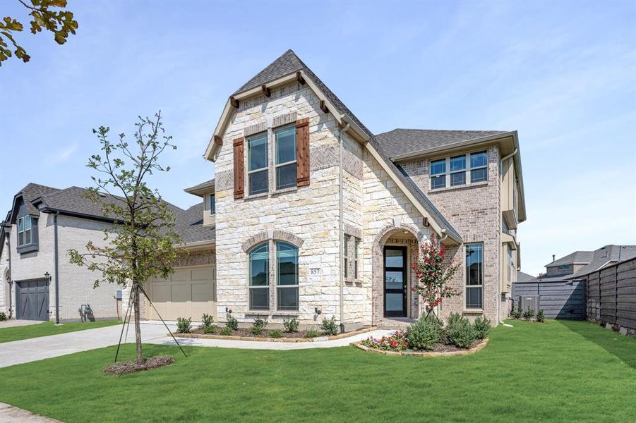 Front exterior of a new home in Union Park Classic 55, Little Elm, TX, highlighting curb appeal (Image 23). Front exterior of a new home in Union Park Classic 55, Little Elm, TX, highlighting curb appeal (Image 23).