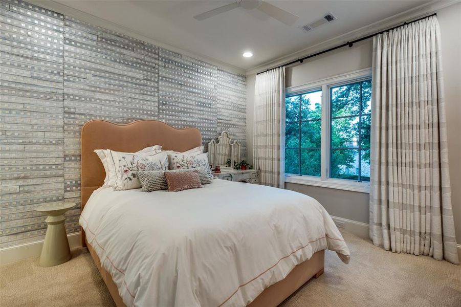 Secondary bedroom with designer wall covering and drapes