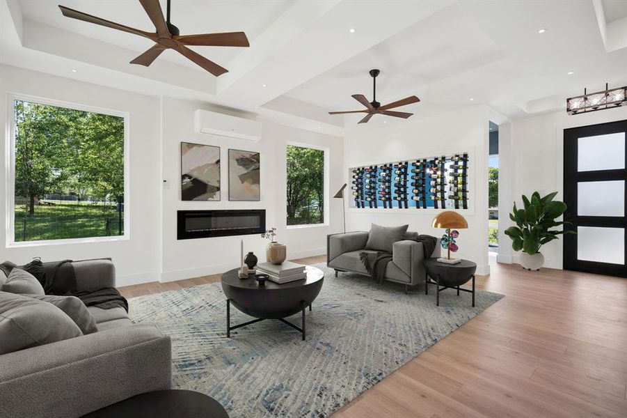 Living Room with wine racks, electric fireplace, dual ceiling fans - virtually staged.