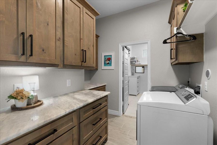 Laundry room with view to her closet.