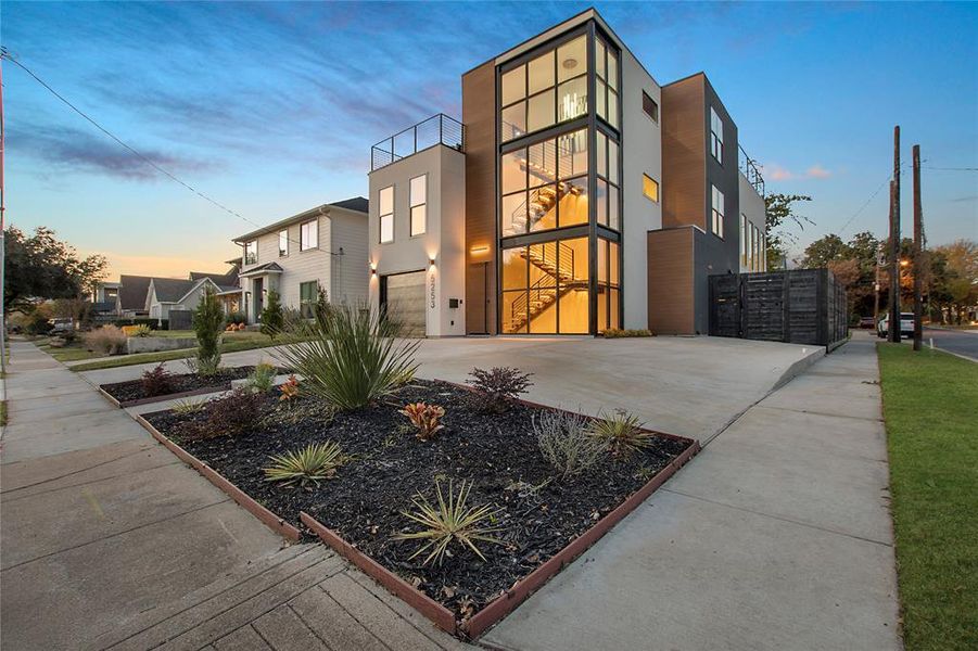 Outdoor building at dusk with a garage