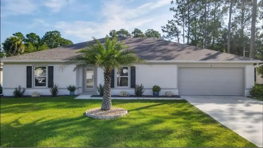 Front exterior of a new home in , Palm Coast, FL, highlighting curb appeal (Image 2). Front exterior of a new home in , Palm Coast, FL, highlighting curb appeal (Image 2).