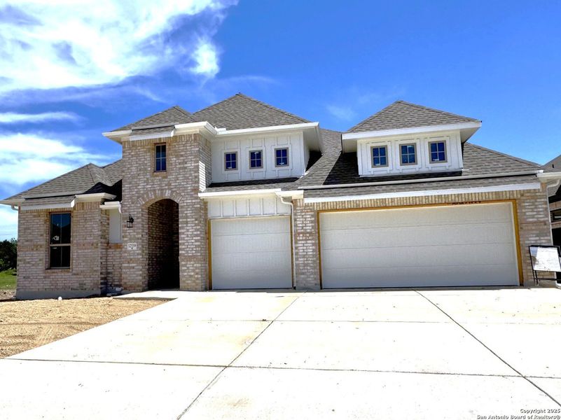 Front exterior of a new home in Stillwater Ranch, San Antonio, TX, highlighting curb appeal (Image 3). Front exterior of a new home in Stillwater Ranch, San Antonio, TX, highlighting curb appeal (Image 3).