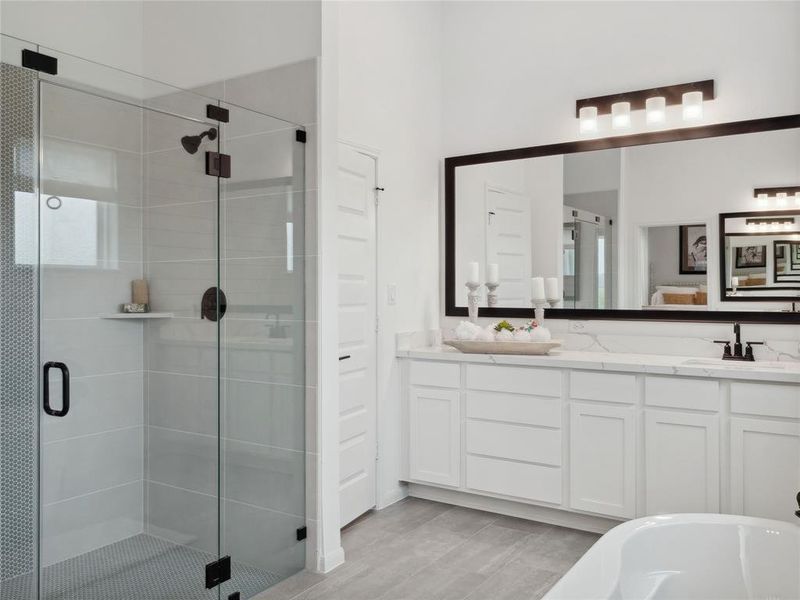 Dual sinks, separate shower and tub in primary bath (*Photo not of actual home and used for illustration purposes only.)