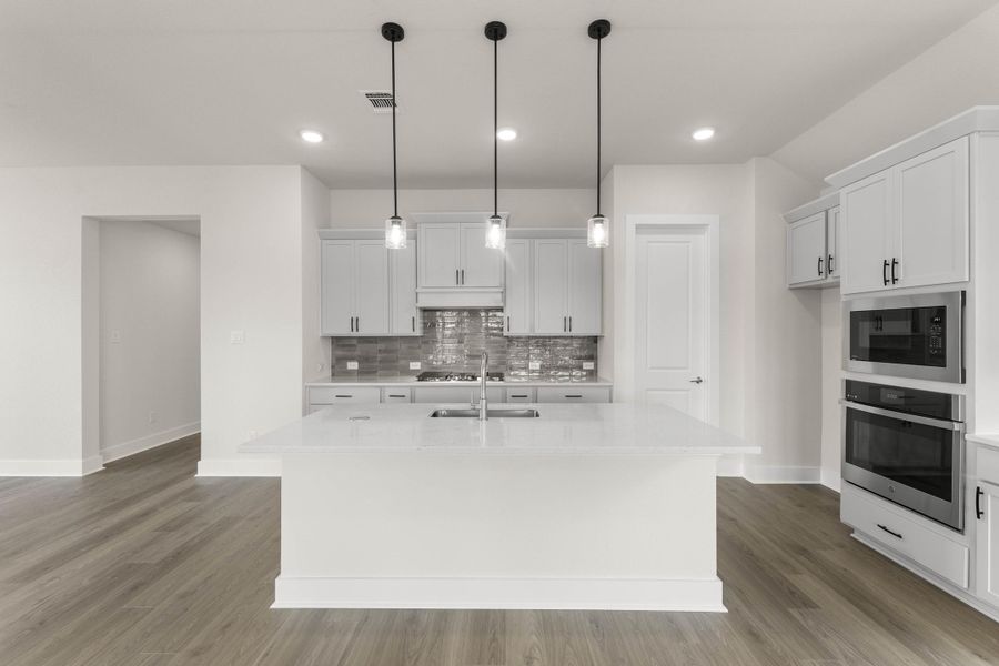Representative furnished interior of a home built from the Hazel by Tri Pointe Homes in Treeline, Justin (Image 6).