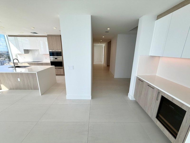 Kitchen, bar, and hallway