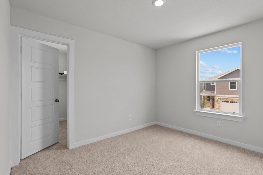 A room with a door and a window.