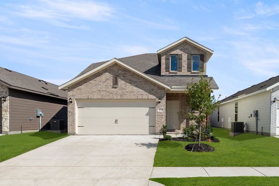 Front exterior of a new home in Creekside Ranch, Blue Ridge, TX, highlighting curb appeal (Image 2).