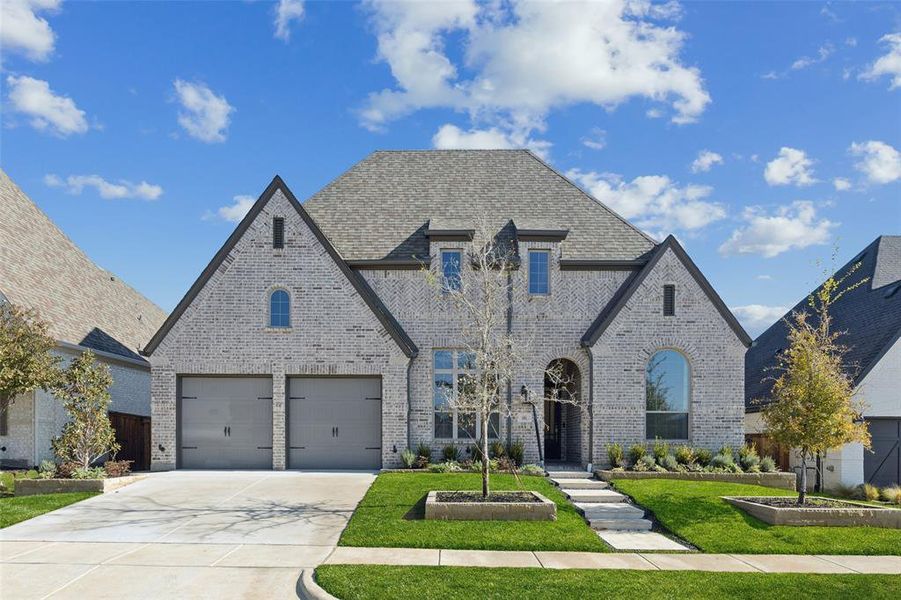 Front exterior of a new home in , Aubrey, TX, highlighting curb appeal (Image 1).
