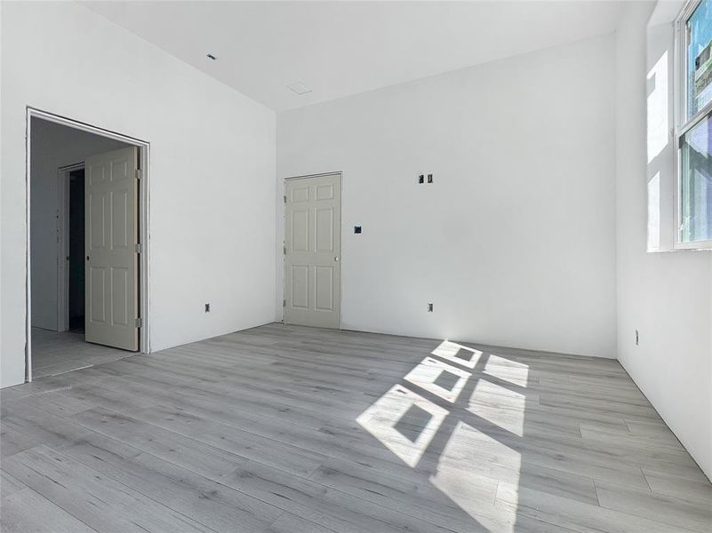 Spare room featuring light wood-style flooring Spare room featuring light wood-style flooring
