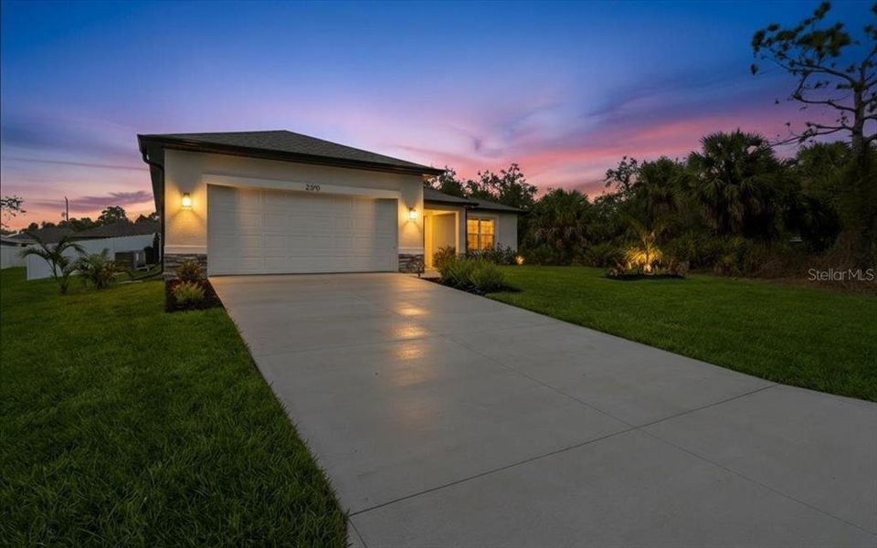Front exterior of a new home in , North Port, FL, highlighting curb appeal (Image 32).