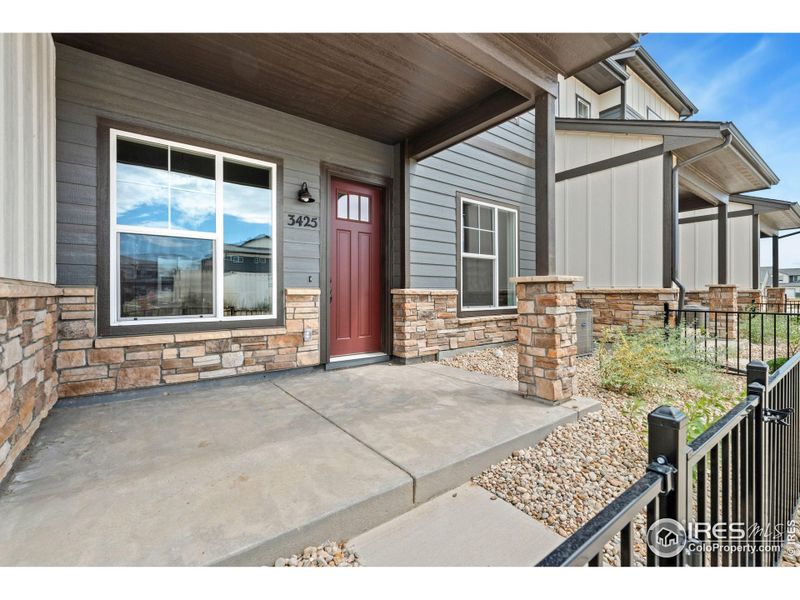 Front exterior of a new home in The Lakes at Centerra - Discovery, Loveland, CO, highlighting curb appeal (Image 2).
