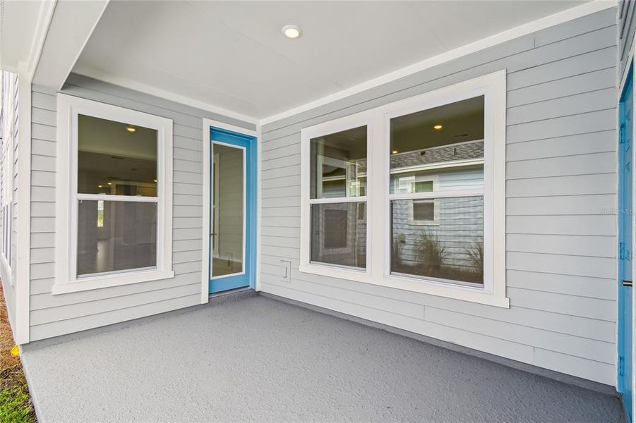 Exterior details and patio area of a home in Weslyn Park in Sunbridge 34', St. Cloud (Image 3).