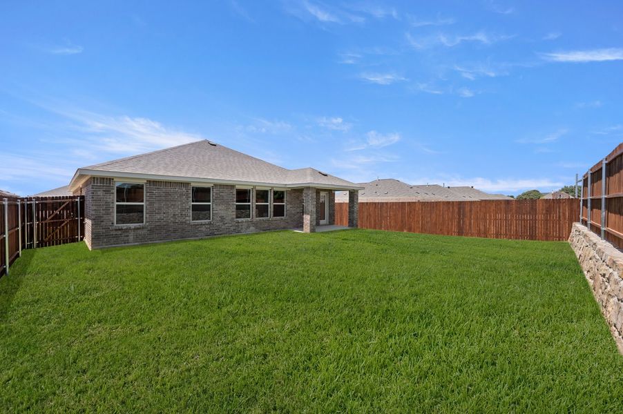 Front exterior of a new home in Baker Farms, Cleburne, TX, highlighting curb appeal (Image 26). Front exterior of a new home in Baker Farms, Cleburne, TX, highlighting curb appeal (Image 26).