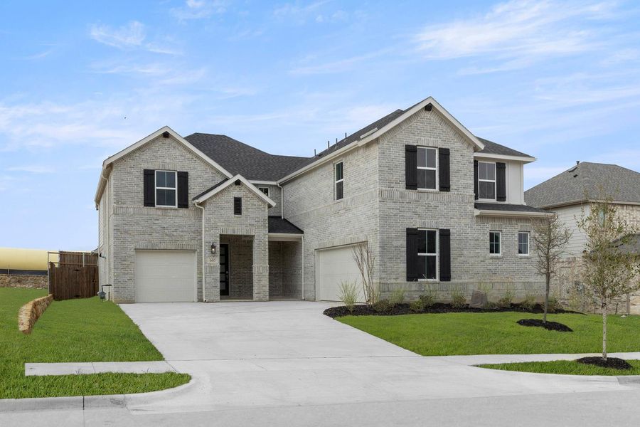 Front exterior of a new home in View at the Reserve, Mansfield, TX, highlighting curb appeal (Image 1). Front exterior of a new home in View at the Reserve, Mansfield, TX, highlighting curb appeal (Image 1).
