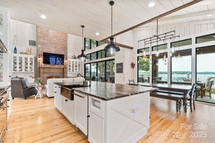 Black-framed windows for uninterrupted lake and pool views Black-framed windows for uninterrupted lake and pool views