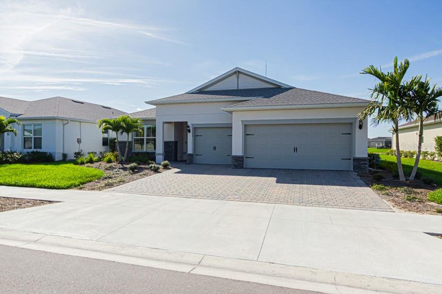 Front exterior of a new home in , Punta Gorda, FL, highlighting curb appeal (Image 19).