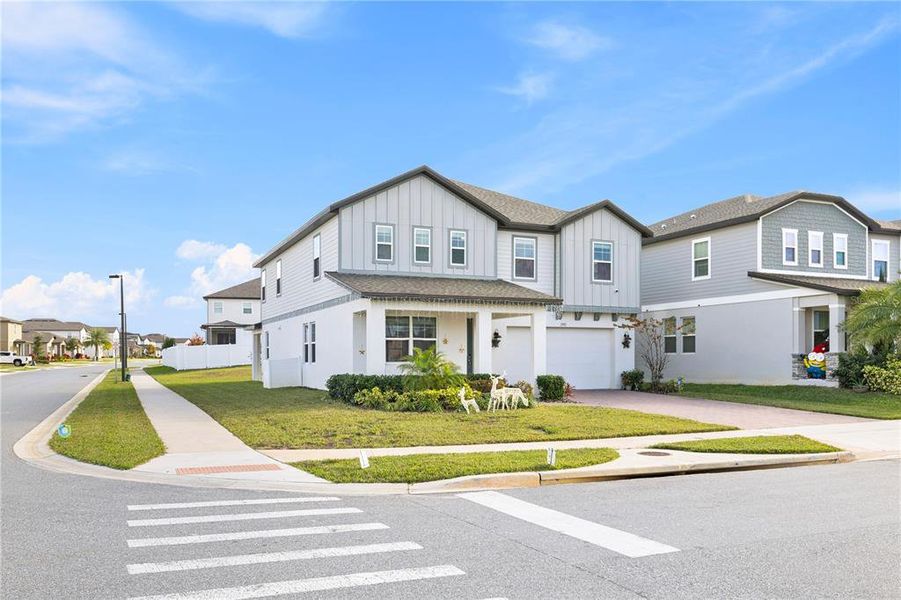 Front exterior of a new home in , Minneola, FL, highlighting curb appeal (Image 27).