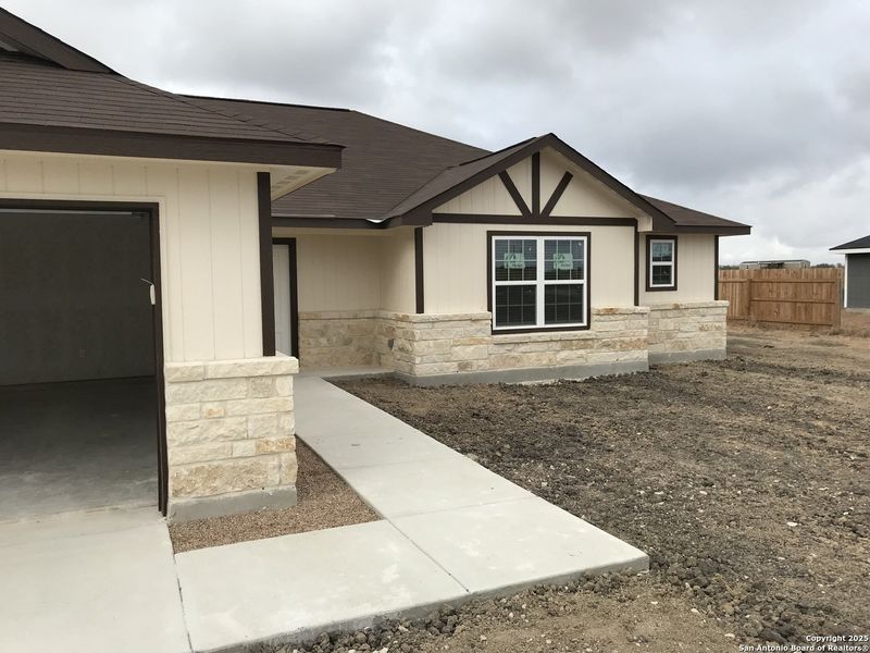 Front exterior of a new home in , Moore, TX, highlighting curb appeal (Image 6).