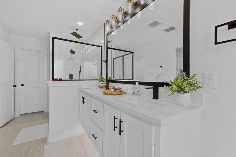 Primary bathroom with double vanity and a stall shower Primary bathroom with double vanity and a stall shower