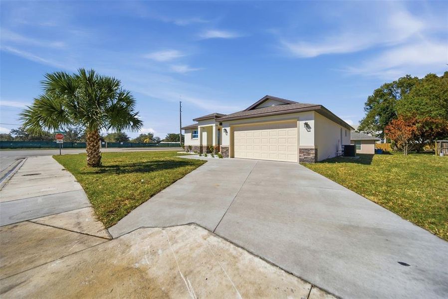 Front exterior of a new home in , Altamonte Springs, FL, highlighting curb appeal (Image 24).