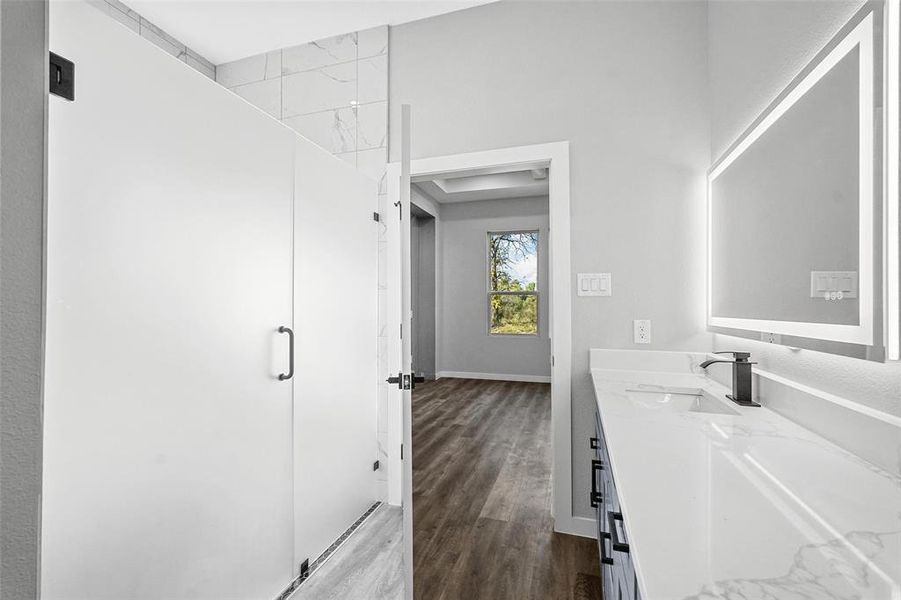 Bathroom featuring vanity and hardwood / wood-style flooring