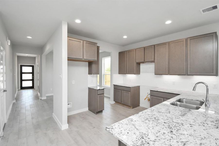 This generously spacious kitchen is a dream realized!