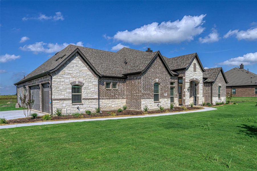 Front exterior of a new home in Pioneer Estates, Blue Ridge, TX, highlighting curb appeal (Image 16). Front exterior of a new home in Pioneer Estates, Blue Ridge, TX, highlighting curb appeal (Image 16).