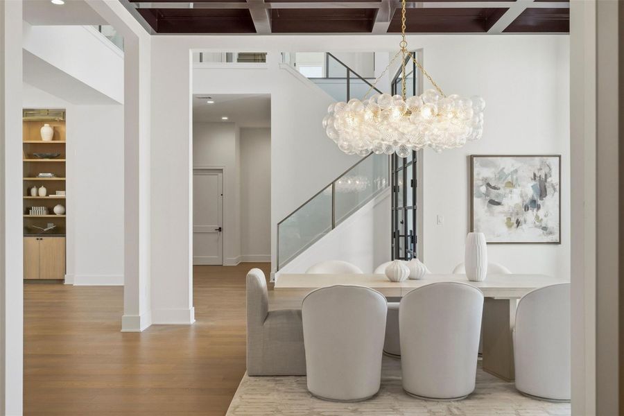 Another view from the formal dining looking at the south wing of the home. Living room is to the left of this photo. Closed door in the distance is the elevator that services all three floors. The hallway to the right of the elevator leads to a powder bath and your first-floor utility room (there's also another utility room servicing the second floor). Another view from the formal dining looking at the south wing of the home. Living room is to the left of this photo. Closed door in the distance is the elevator that services all three floors. The hallway to the right of the elevator leads to a powder bath and your first-floor utility room (there's also another utility room servicing the second floor).