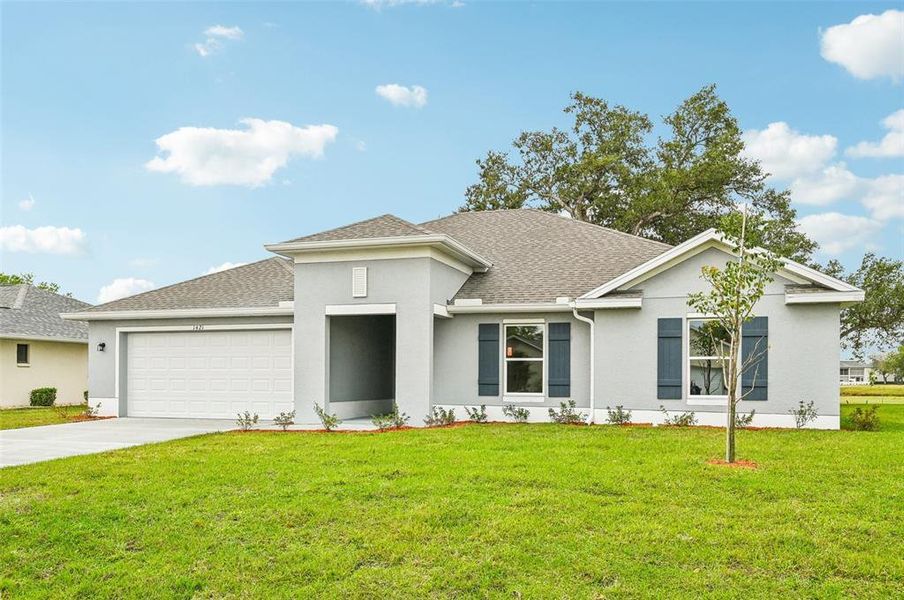 Front exterior of a new home in Sugarmill Woods, Homosassa, FL, highlighting curb appeal (Image 1). Front exterior of a new home in Sugarmill Woods, Homosassa, FL, highlighting curb appeal (Image 1).