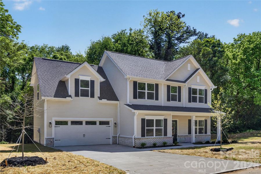 Front exterior of a new home in , Charlotte, NC, highlighting curb appeal (Image 1). Front exterior of a new home in , Charlotte, NC, highlighting curb appeal (Image 1).