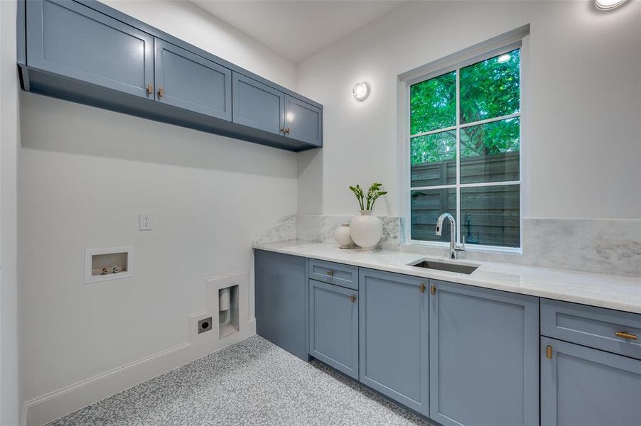 Laundry featuring cabinet space, washer hookup, and electric dryer hookup