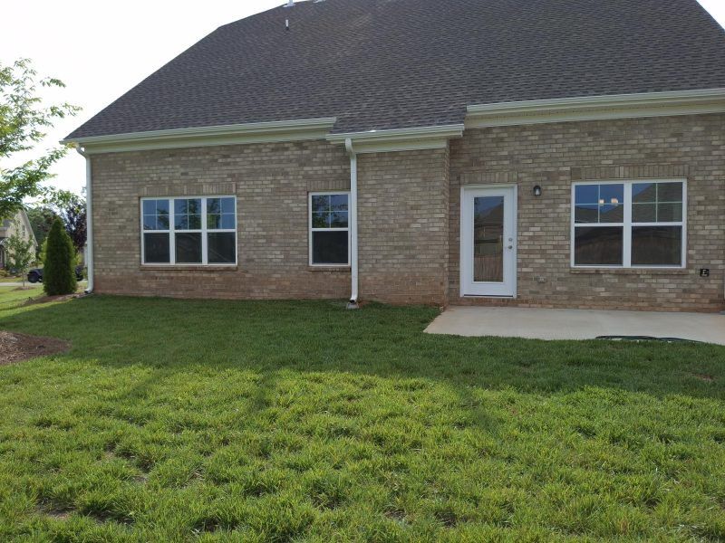 Exterior details and patio area of a home in Weybridge, Burlington (Image 4).