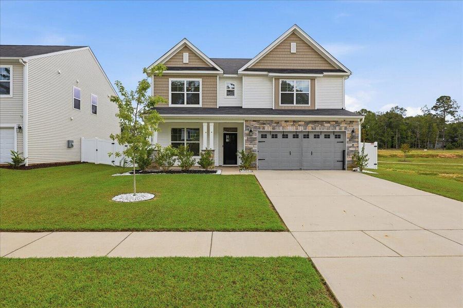 Front exterior of a new home in , Ridgeville, SC, highlighting curb appeal (Image 27). Front exterior of a new home in , Ridgeville, SC, highlighting curb appeal (Image 27).