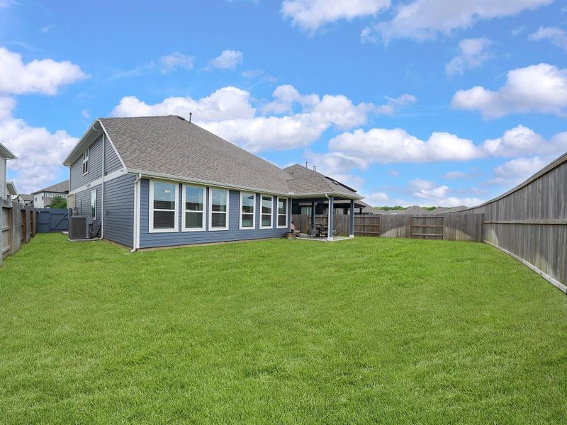 A spacious backyard provides a blank canvas for outdoor living, play, or future customization to fit your vision.