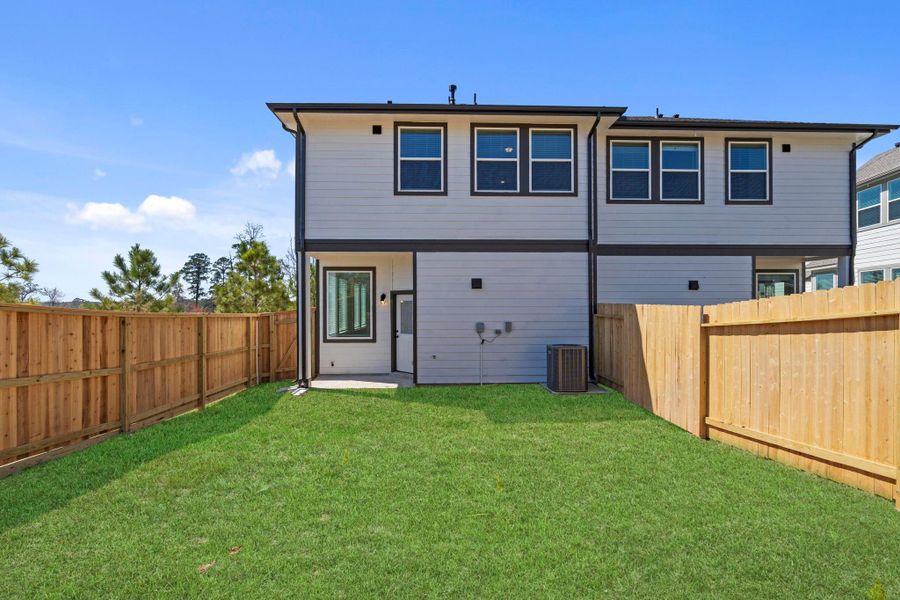 Exterior details and patio area of a home in Woodforest, Montgomery (Image 3).