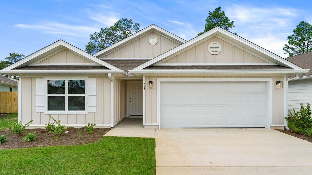 Front exterior of a new home in Ashton Park Phase III, Freeport, FL, highlighting curb appeal (Image 1).