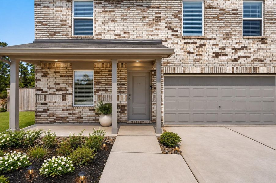 Step inside through the welcoming entry, where thoughtful details immediately make you feel at home.Flower bed has been virtually enhanced with flowers