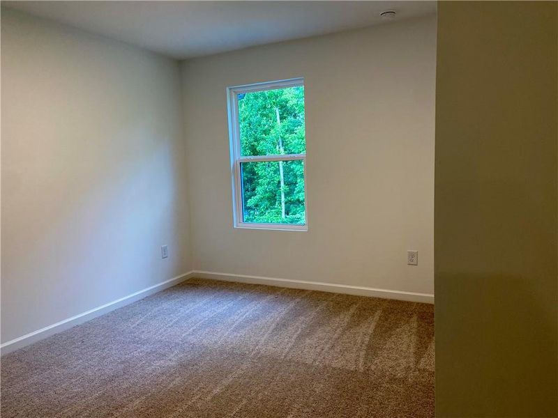Spacious, unfurnished interior of a new home in Eastlyn Crossing, Flowery Branch (Image 21).
