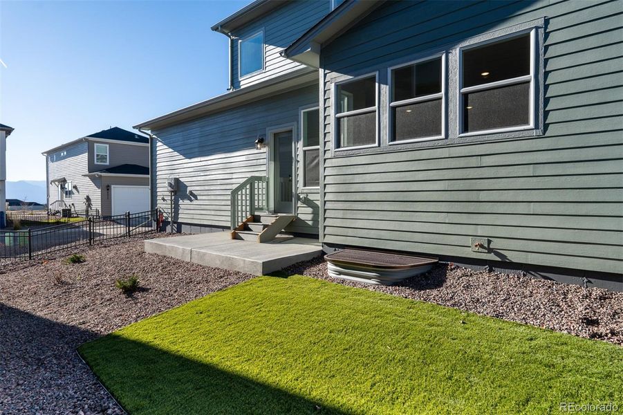 Exterior details and patio area of a home in Revel Crossing at Wolf Ranch – The Outlook Collection, Colorado Springs (Image 4).